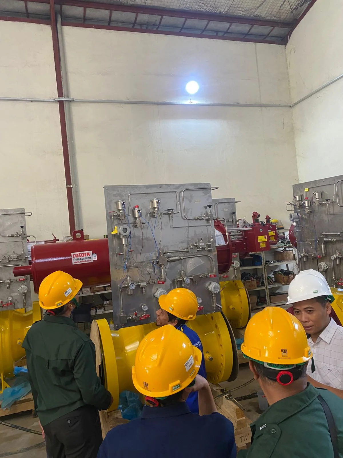 TMK engineers inspecting an actuated valve package